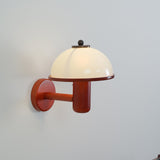 Oak wall lamp with a white dome shade seen from a slight angle, unlit