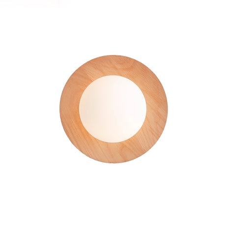 Oak disc seen flat on, the frosted globe filling most of the opening