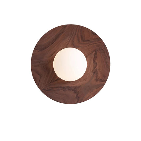 Black walnut disc seen from the front, the white globe unlit at its middle