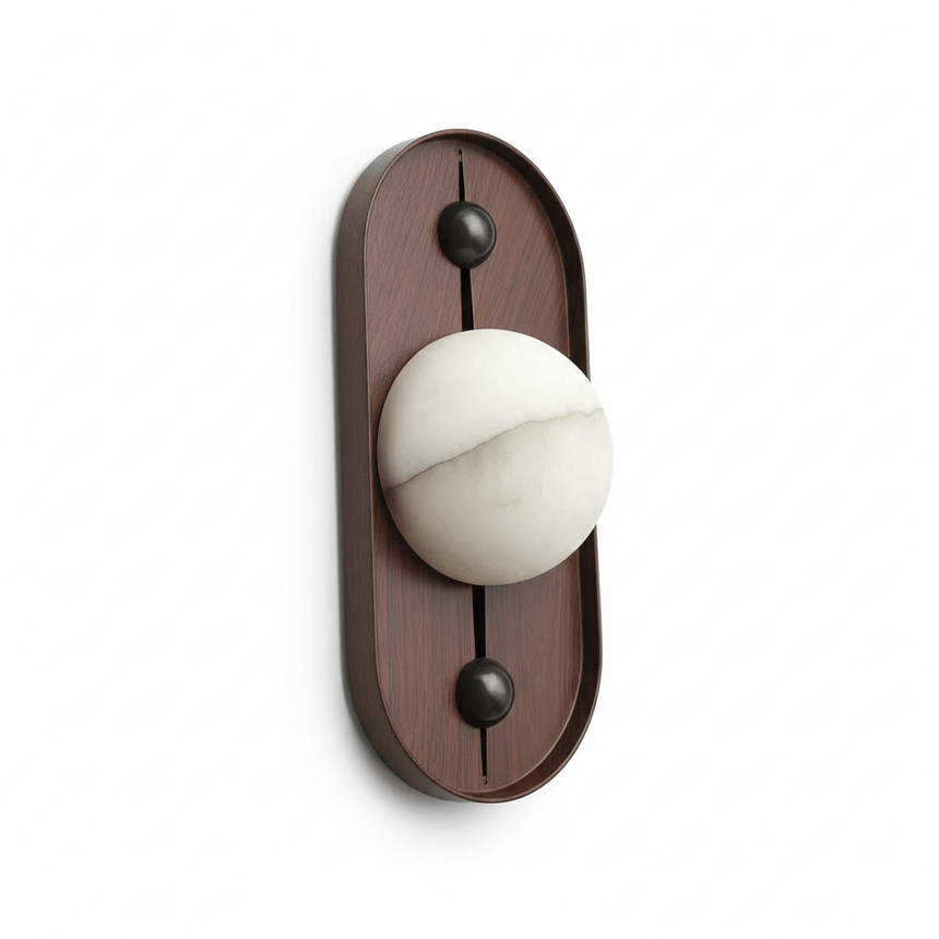 Alabaster orb on a tall narrow oval walnut plate, seen unlit
