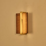 The dark wings with a brass bar, unlit, seen against a warm ground