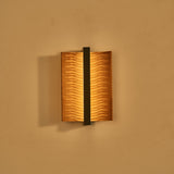 The fitting lit, warm light washing out from behind both curved wings