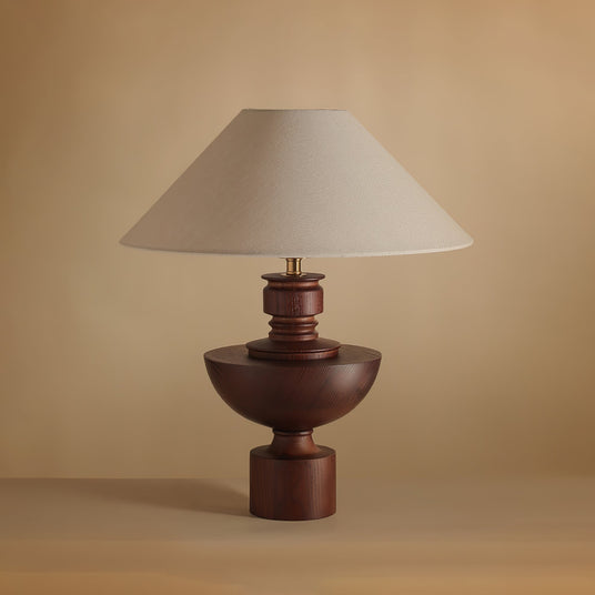 Close view of the turned walnut vase base and the brass collar