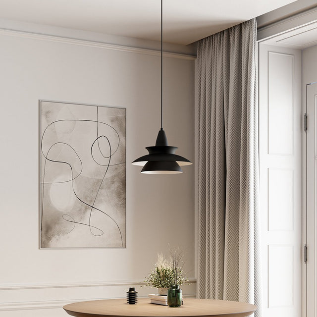 Metal pendant light with sleek modern silhouette accent