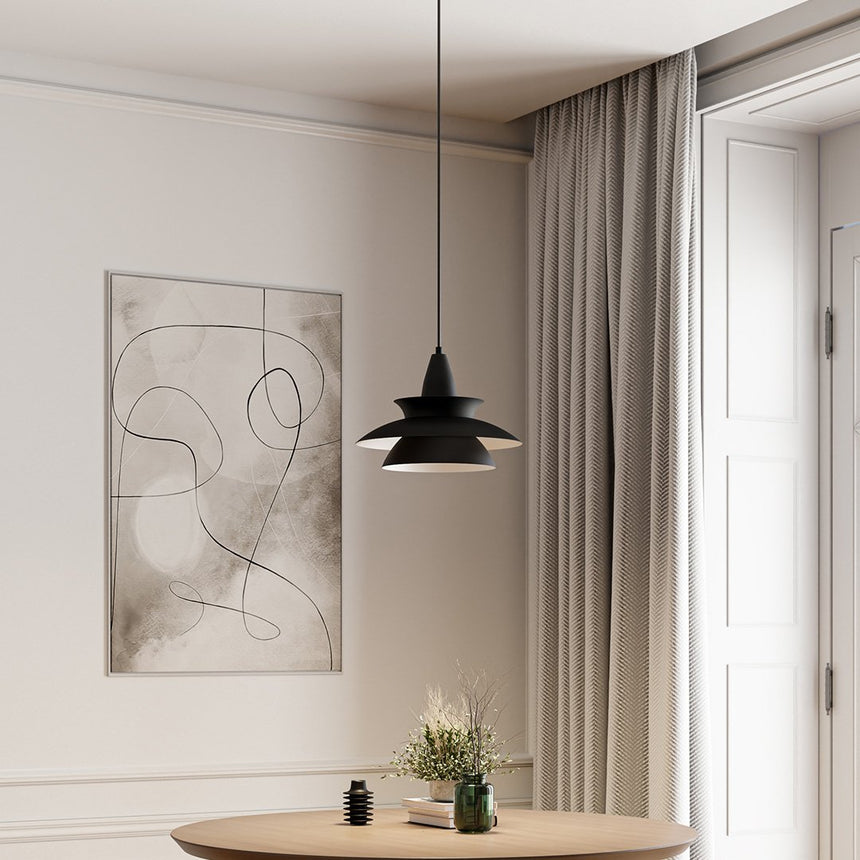 Metal pendant light with sleek modern silhouette accent