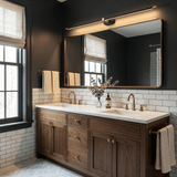 Slim rod lit above a wide mirror over a double basin vanity on a tiled wall