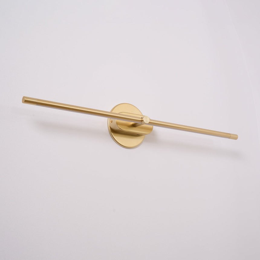 The gold version seen straight on, a thin rod through a round gold boss