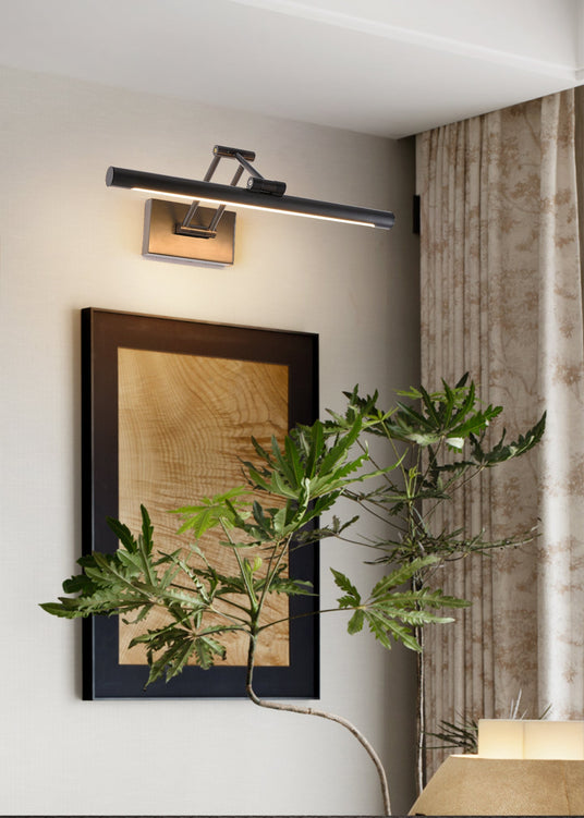 Black bar lit above a large framed panel beside a curtain and a leafy plant