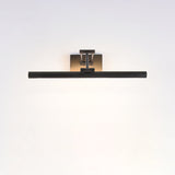 The longest black bar lit on a pale wall, the light reaching wall to wall below