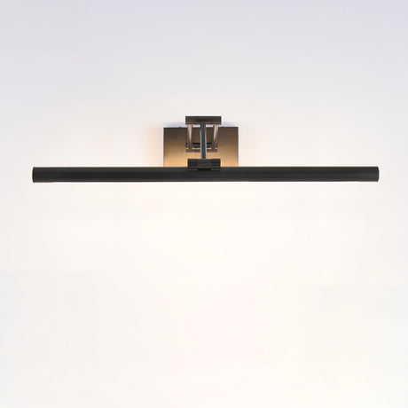 The middle black bar lit on a pale wall, brass bracket centered above the tube