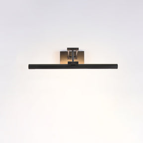 The shortest black bar lit on a pale wall, the beam spreading evenly below it