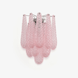 Wall sconce of layered pink textured glass petals falling in three tiers