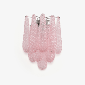 Wall sconce of layered pink textured glass petals falling in three tiers