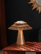 Two boho table lamps of different sizes on a checkered table