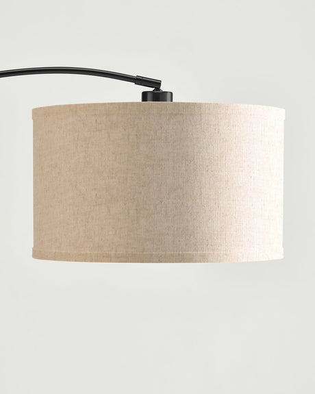 The oatmeal linen drum seen close, the weave and the top ring visible