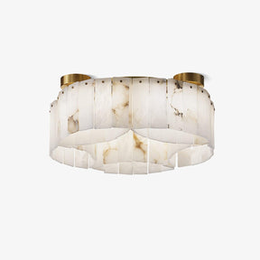 Brass flush mount ceiling light with overlapping alabaster panels on a brass frame