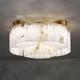 Alabaster panel ceiling light seen from below with the stone lit
