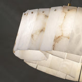 Angled view of the alabaster panels and their brass fasteners