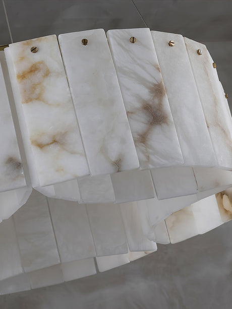 Close view of the lower row of alabaster panels and the brass pins
