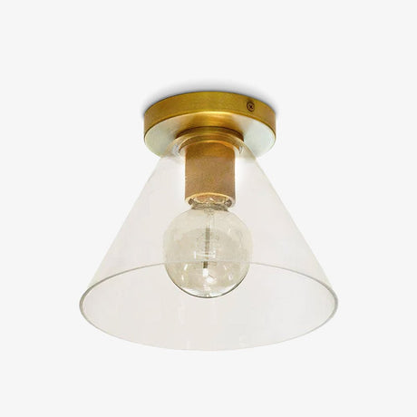 Brass ceiling light with a cone shade and a filament bulb on a pale backdrop