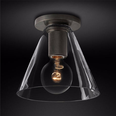Black ceiling light with a clear cone shade against a dark backdrop