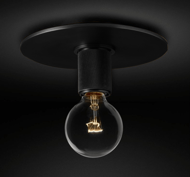 Black ceiling light seen from the side with a bare filament bulb