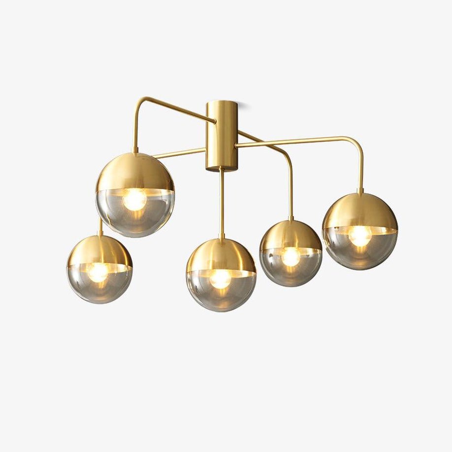 Brass globe ceiling light with five half plated glass globes on brass arms