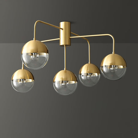 Five globe brass ceiling light lit against a gray background