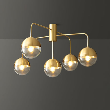 Five globe brass ceiling light seen at an angle against a gray background