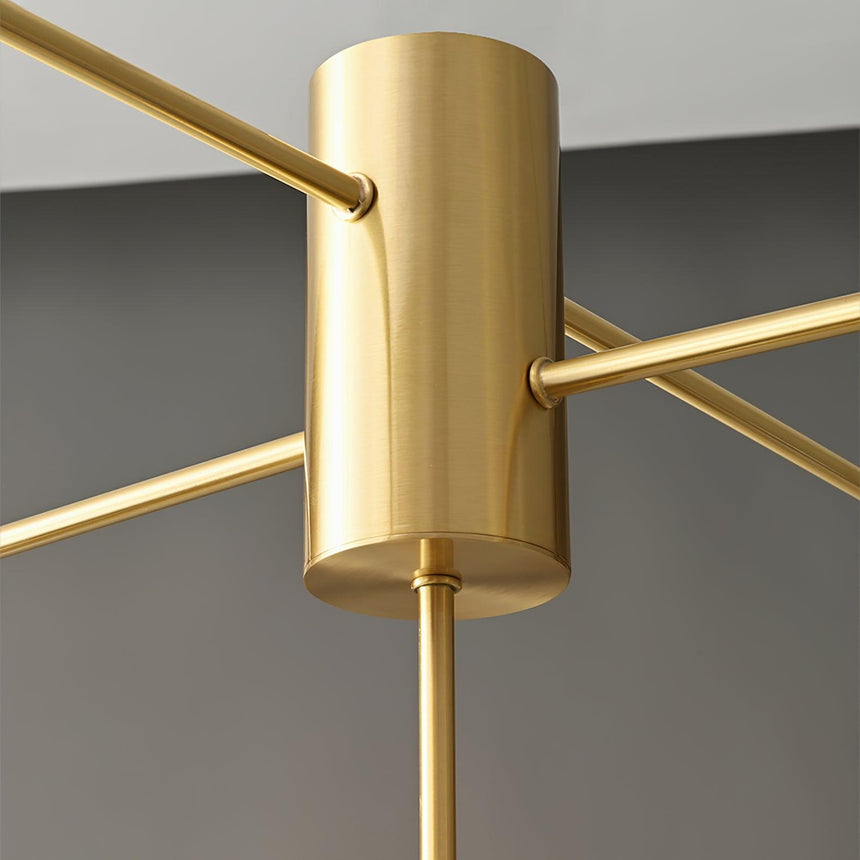 Close view of the central brass column where the arms meet