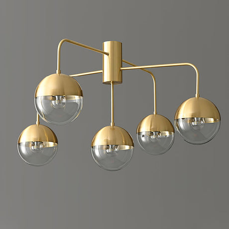 Five globe brass ceiling light lit and seen from the side