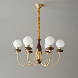 The walnut column and the textured brass stem above it