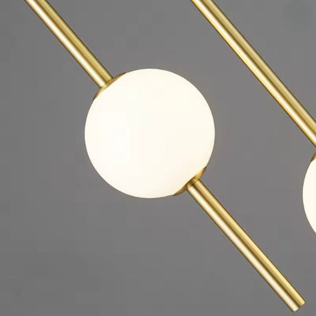 Close view of the opal globe held where two brass rods cross