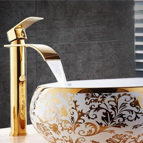 Gold and white waterfall bathroom faucet with deck mounted single handle