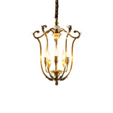 The scroll frame lit, showing the curled finials at the top of each upright