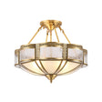 Brass semi flush mount ceiling light with milk glass panels in a cast brass frame