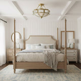Brass and milk glass ceiling light above a four poster bed