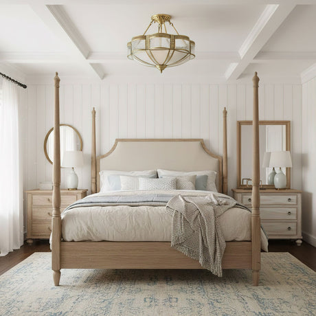 Brass and milk glass ceiling light above a four poster bed