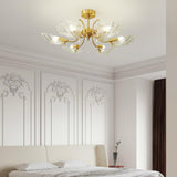 Shell shade ceiling light above a bed in a room with paneled walls