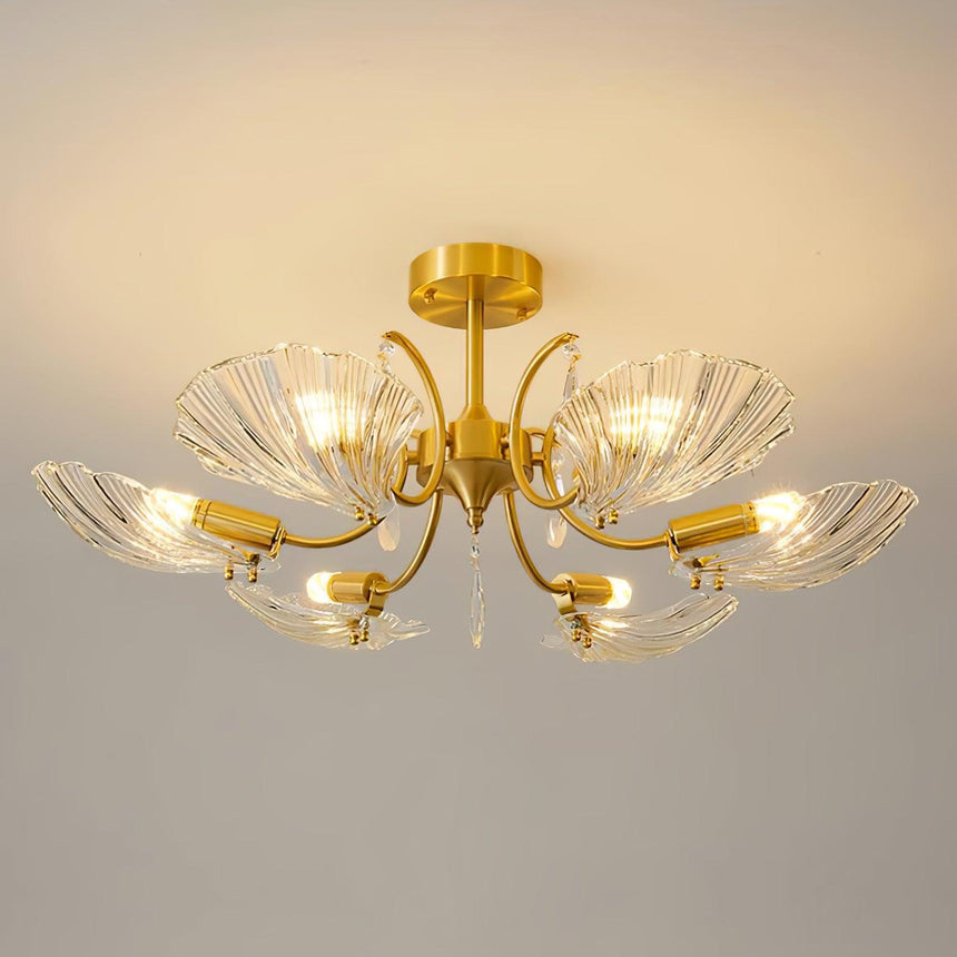 Shell shade ceiling light lit against a warm ceiling