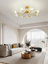 Shell shade ceiling light above a sofa beside an arched opening