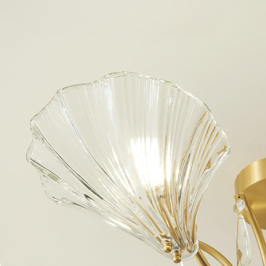 Close view of the ribbed glass shell and its brass fitting