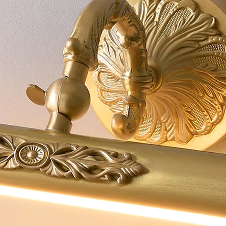 Close view of the raised leaf pattern along the cast brass body of the bar