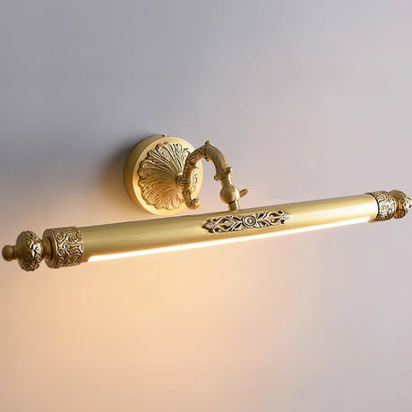 The lit brass bar seen at an angle, the diffuser bright under the cast body