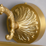 Close view of the cast shell plate and the scrolled arm rising from it