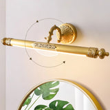 The brass bar shown turning on its joint above a round mirror with a leafy print