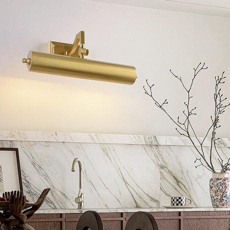 Brass tube on a marble bathroom wall above a tap and a vase of branches