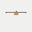 The shortest bronze bar seen straight on with the pivot arm centered above it
