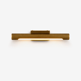 Slim bronze bar lit along its underside, a small block at its center