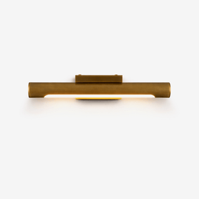 Slim bronze bar lit along its underside, a small block at its center